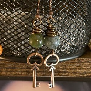 Guilded key lotus earnings in Antique brass